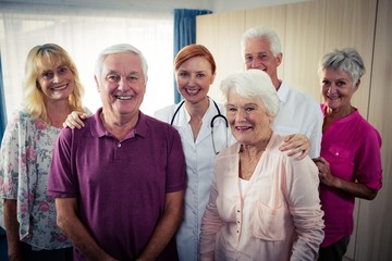 Portrait of a group of pensioners with nurse