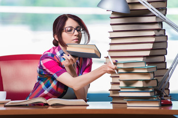 Young female student preparing for exams