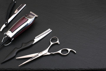 Barber shop tools on Black with place for text.