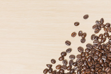 Coffee beans on wood table with copyspace for text