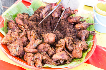 Fried chicken with spice, popular at food bazaar during Ramadan.