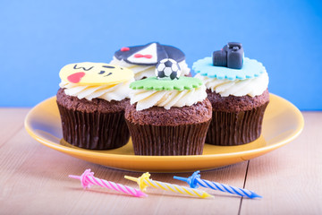 Delicious cupcakes on table