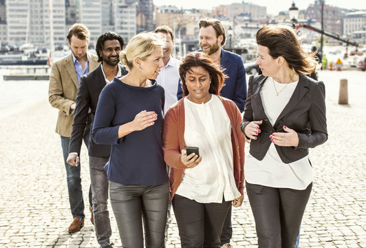 Group Of People Walking On Street