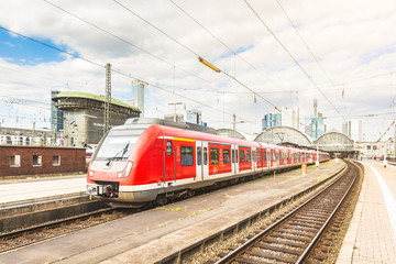 Naklejka na ściany i meble Train coming out from the station in Frankfurt