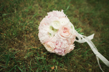 Wonderful luxury wedding bouquet of different flowers