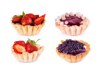 Collection of cupcakes with strawberry, currant, mint and jam on