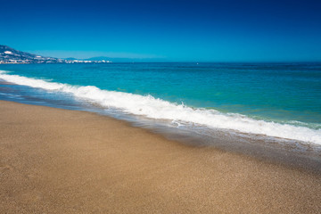 Soft Sea Ocean Waves Wash Over Golden Sand Background. Yellow sa
