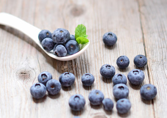 Fresh blueberry on wooden background closeup