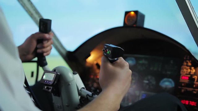Hands of beginner pilot shaking during first flight, nervous aviation student