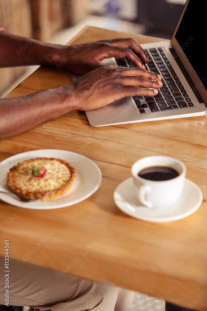 Poster cropped image of casual man using laptop