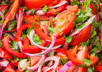 salad from tomatoes, cucumbers, onion close up