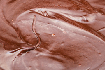 surface of brown melted milk chocolate