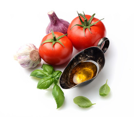fresh basil, tomatoes and oil on a white background