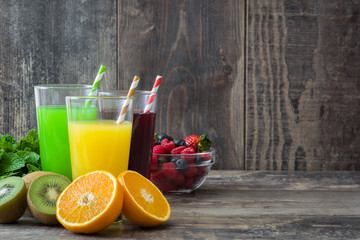 Fresh fruit smoothies on a rustic wooden background

