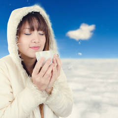 Beautiful Woman with winter anorak and mug of hot tea with blurr © nuiiko