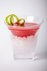 Red cocktail drink with ice closeup isolated on white background
