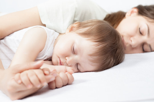 Closeup hands of mother and baby