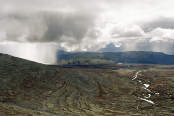 Clouds over barren landscape