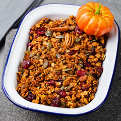 Healthy breakfast. Fresh granola, muesli with pumpkin,pecan nuts,cranberries and maple syrup