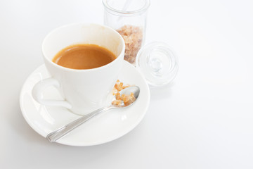 White cup of coffee on white wood table