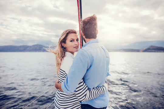 Young couple on yacht sailing in sea