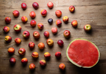 Naklejka na ściany i meble red fruits on a wooden table