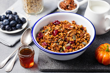 Healthy breakfast. Fresh granola, muesli with pumpkin,pecan nuts,cranberries and maple syrup
