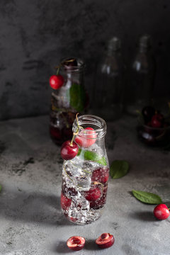 Cherry lemonade with ice and soda. Sweet Refreshing Vertical shooting