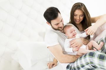 Fototapeta na wymiar Happy family with newborn baby