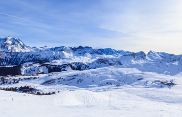 Fototapeta na wymiar View of snow covered Courchevel slope in French Alps