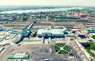 Aerial city view with crossroads and roads, houses, buildings, parks and parking lots, bridges. Urban landscape. Copter shot. Panoramic image.