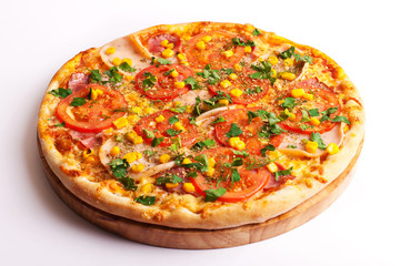 Pizza with ham, tomatoes and corn isolated on white