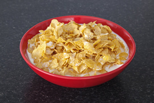 Bowl Of Cornflakes Healthy Breakfast Cereal, In Red Bowl.