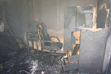 chair and furniture in room after burned by fire in burn scene