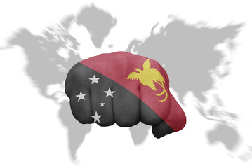 fist with the national flag of Papua New Guinea on a world map background