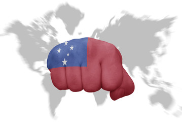 fist with the national flag of Samoa on a world map background