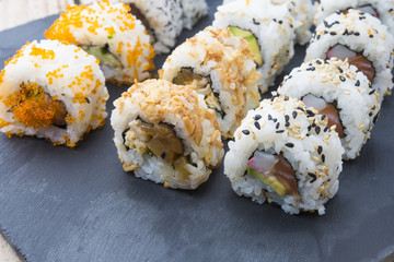 Sushi rolls on a slate plate