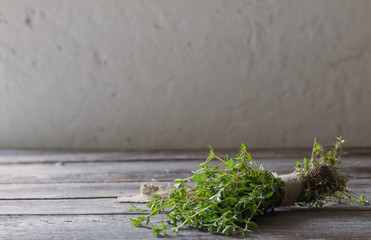 Thyme bunch on old wooden table
