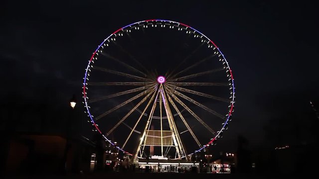 Illuminated roue de Paris at night in Paris