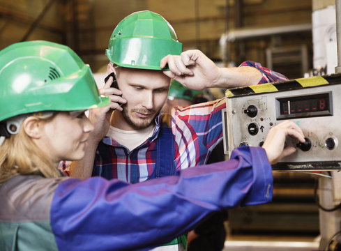 Colleagues in green helmets
