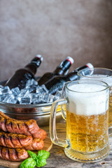 Grilled sausages  and mugs of beer