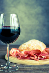 Red wine with prosciutto and ciabatta