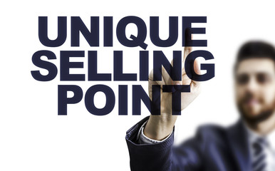 Business man pointing the text: Unique Selling Point