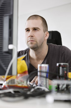 Concentrated man by the computer