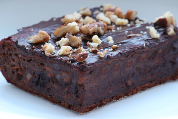 Delicious chocolate brownie. Close up of chocolate brownies. Delicious homemade chocolate cakes on top with walnuts. Shallow depth of field.