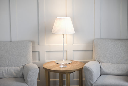 Empty hotel lobby  with arm chair and table lamp