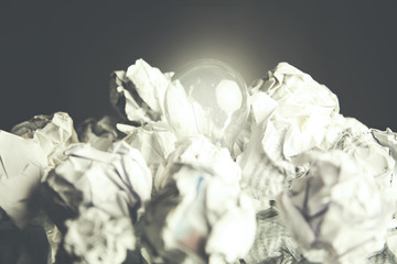 light  bulb and papers