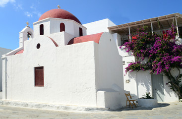 A white church with red roof on Mykonos island, Greece