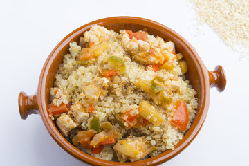 High-key image of white plate with quinoa lentil salad and bowl