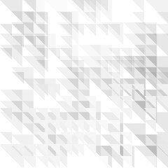 Obraz premium A modern abstract geometric background featuring a mosaic pattern of overlapping white and light gray triangles, creating a subtle low-poly texture.